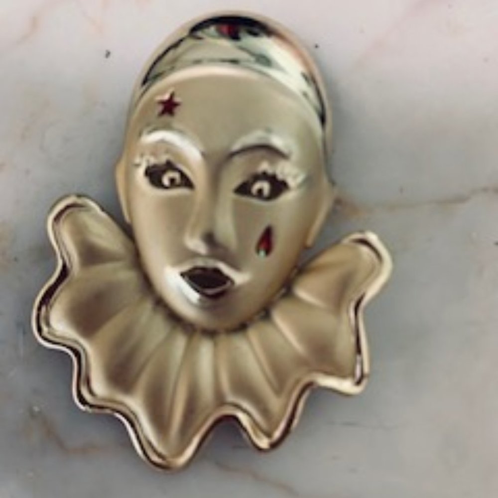 Golden clown pin